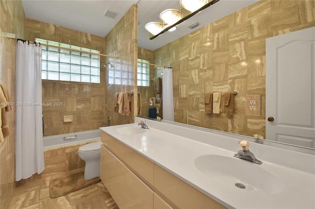2701 Edgewater Ct, Weston, FL 33332 - bathroom featuring tiled shower / bath, toilet, and double vanity