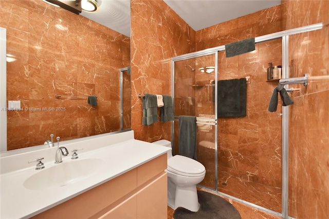 2701 Edgewater Ct, Weston, FL 33332 - full bathroom featuring a stall shower, tile walls, toilet, and vanity