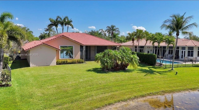 2701 Edgewater Ct, Weston, FL 33332 - view of front of home with stucco siding, a tile roof, and a front lawn