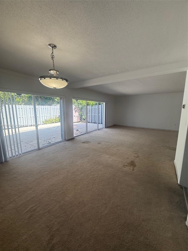 288 Sea View Dr Unit C2, Key Biscayne, FL 33149 - unfurnished room featuring carpet floors, a textured ceiling, and beam ceiling