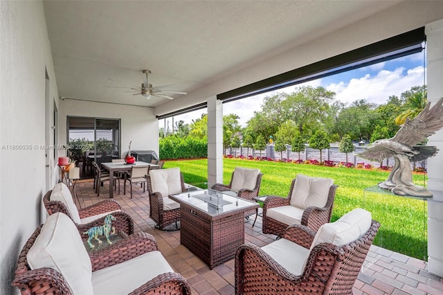 view of patio featuring an outdoor hangout area, a ceiling fan, and outdoor dining space