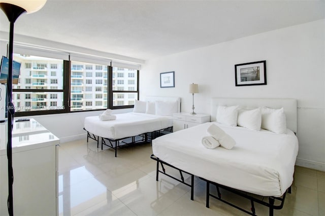 5225 Collins Ave Unit 1409, Miami Beach, FL 33140 - bedroom featuring light tile patterned floors and baseboards