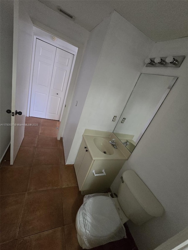6520 NW 114th Ave Unit 1637, Doral, FL 33178 - bathroom with toilet, tile patterned floors, vanity, and baseboards
