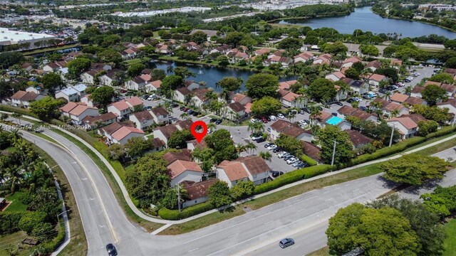 805 NW 108th Ter Unit 7L5, Pembroke Pines, FL 33026 - aerial view of property and surrounding area featuring a nearby body of water and nearby suburban area
