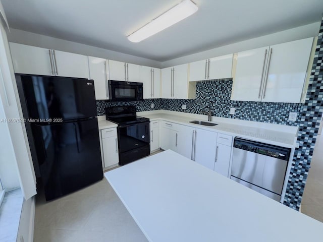 805 NW 108th Ter Unit 7L5, Pembroke Pines, FL 33026 - kitchen featuring black appliances, tasteful backsplash, light tile patterned floors, a sink, and white cabinetry