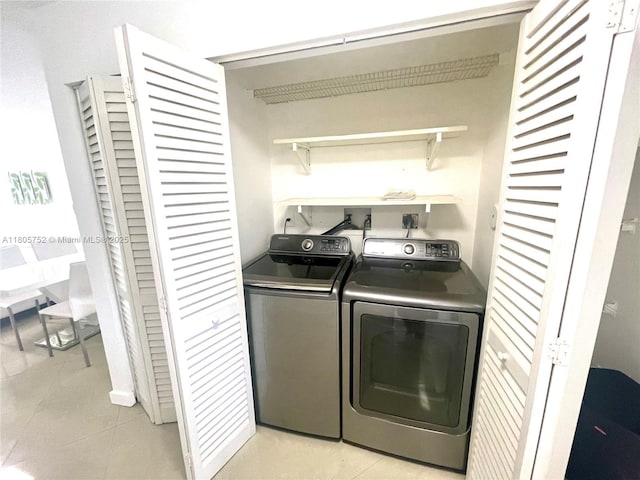 805 NW 108th Ter Unit 7L5, Pembroke Pines, FL 33026 - laundry area with washing machine and clothes dryer and light tile patterned floors