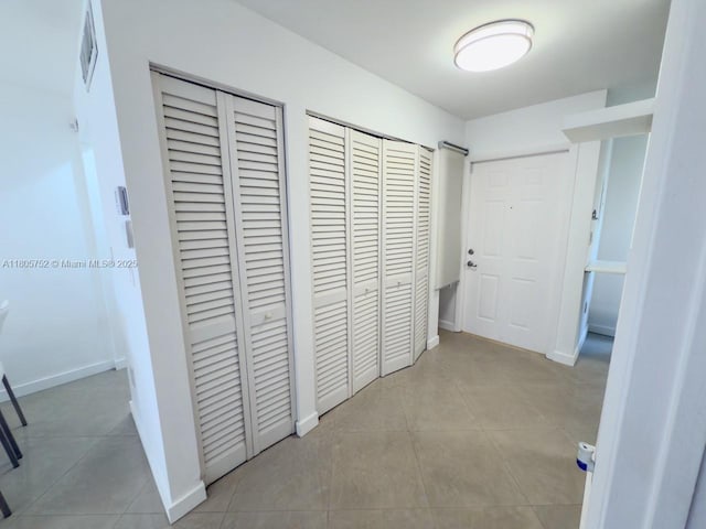805 NW 108th Ter Unit 7L5, Pembroke Pines, FL 33026 - hallway with tile patterned floors and baseboards