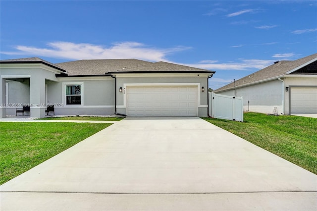434 SW Namoit Pl, Port St Lucie, FL 34953 - view of front of house featuring an attached garage, concrete driveway, stucco siding, and roof with shingles