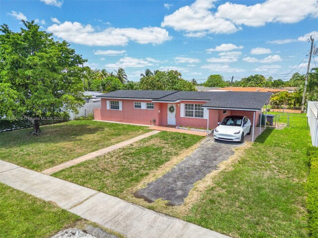 4230 SW 97th Pl, Miami, FL 33165 - single story home with driveway, a carport, and stucco siding