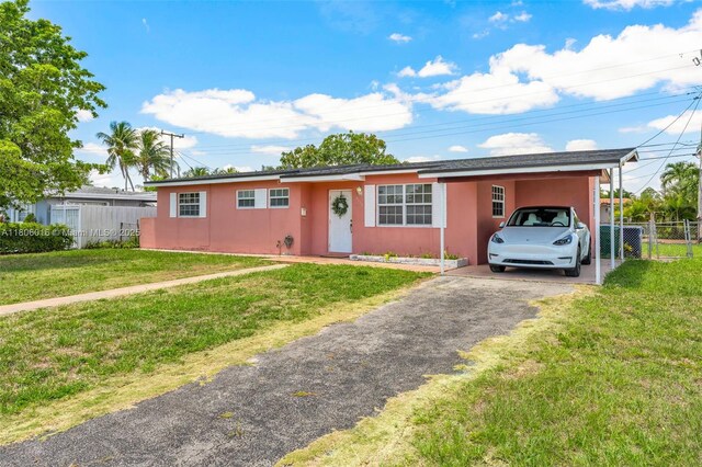 4230 SW 97th Pl, Miami, FL 33165 - ranch-style home with asphalt driveway, stucco siding, and a carport
