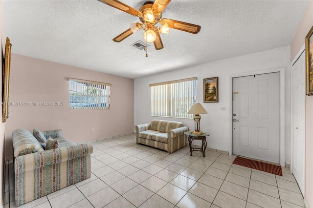 4230 SW 97th Pl, Miami, FL 33165 - living room featuring a textured ceiling, ceiling fan, and light tile patterned floors