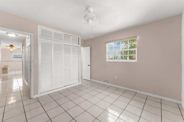 4230 SW 97th Pl, Miami, FL 33165 - unfurnished bedroom with a closet, baseboards, and light tile patterned floors