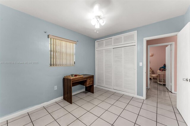 4230 SW 97th Pl, Miami, FL 33165 - unfurnished bedroom with a closet, baseboards, and light tile patterned floors