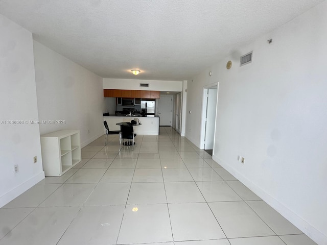 1750 N Bayshore Dr Unit 2906, Miami, FL 33132 - unfurnished living room with a textured ceiling and baseboards