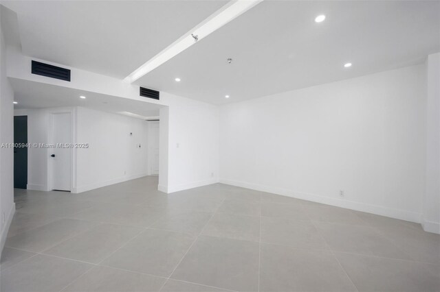 20281 E Country Club Dr Unit 1008, Aventura, FL 33180 - empty room with light tile patterned flooring, recessed lighting, and baseboards
