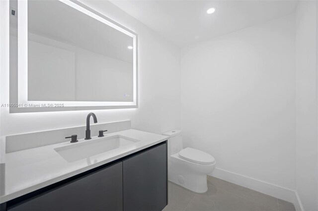 20281 E Country Club Dr Unit 1008, Aventura, FL 33180 - half bathroom featuring toilet, vanity, tile patterned flooring, recessed lighting, and baseboards