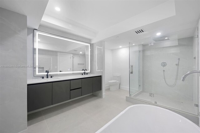 20281 E Country Club Dr Unit 1008, Aventura, FL 33180 - bathroom featuring a shower stall, double vanity, recessed lighting, a soaking tub, and tile patterned flooring