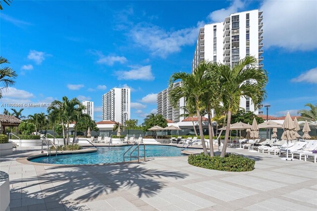 20281 E Country Club Dr Unit 1008, Aventura, FL 33180 - community pool featuring a patio area