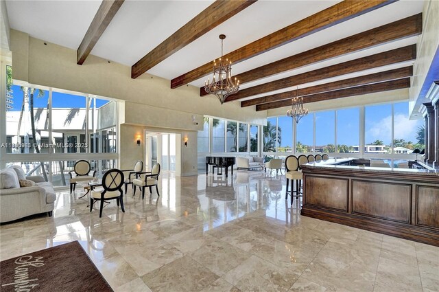 20281 E Country Club Dr Unit 1008, Aventura, FL 33180 - living room with a chandelier, beamed ceiling, plenty of natural light, and marble tiled floors