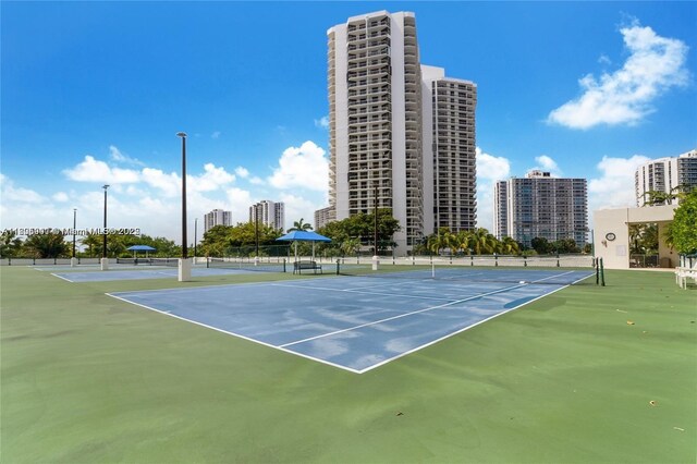 20281 E Country Club Dr Unit 1008, Aventura, FL 33180 - view of tennis court featuring a view of city