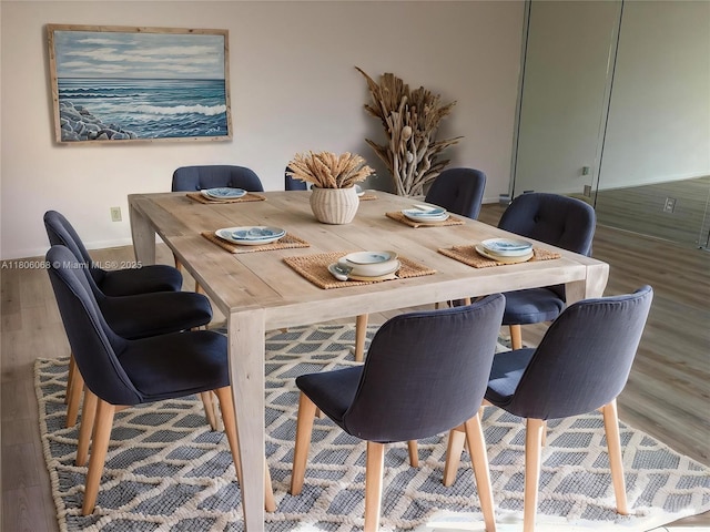 235 E Burgundy E Unit 235, Delray Beach, FL 33484 - dining area with wood finished floors and baseboards