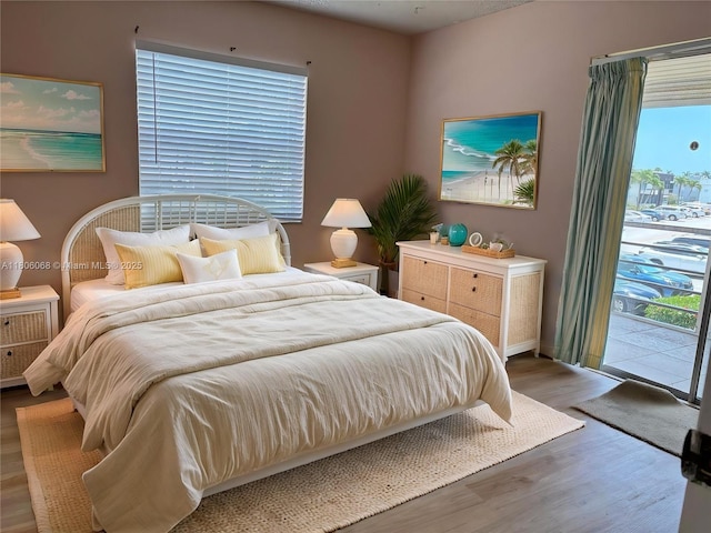 235 E Burgundy E Unit 235, Delray Beach, FL 33484 - bedroom with access to outside and wood finished floors