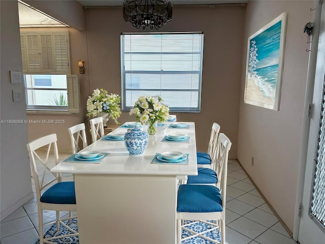 235 E Burgundy E Unit 235, Delray Beach, FL 33484 - dining space featuring light tile patterned floors and a chandelier