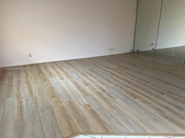 235 E Burgundy E Unit 235, Delray Beach, FL 33484 - unfurnished room with wood finished floors and baseboards