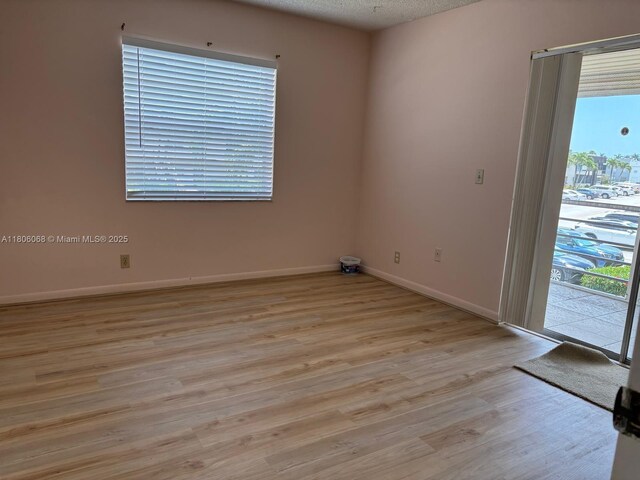 235 E Burgundy E Unit 235, Delray Beach, FL 33484 - empty room featuring light wood-style floors and baseboards