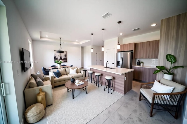 7006 Calder Cir, La Belle, FL 33935 - living room with recessed lighting, light tile patterned flooring, and a tray ceiling