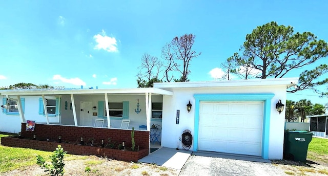 818 Lake Mcgregor Dr, Fort Myers, FL 33919 - single story home with a garage, covered porch, and stucco siding