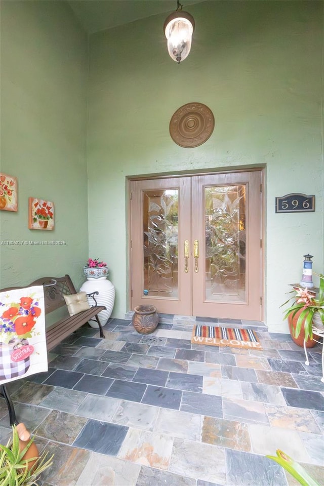 596 NW 164th Ave, Pembroke Pines, FL 33028 - view of exterior entry featuring french doors and stucco siding
