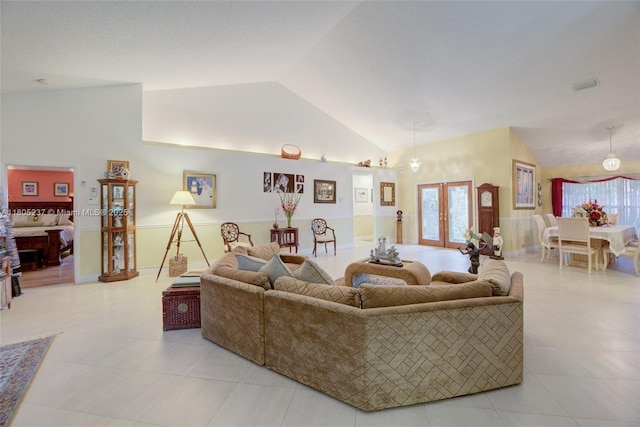 596 NW 164th Ave, Pembroke Pines, FL 33028 - living area with lofted ceiling, light tile patterned floors, and french doors