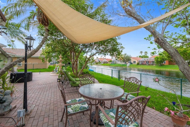 596 NW 164th Ave, Pembroke Pines, FL 33028 - view of patio / terrace featuring a water view and outdoor dining space