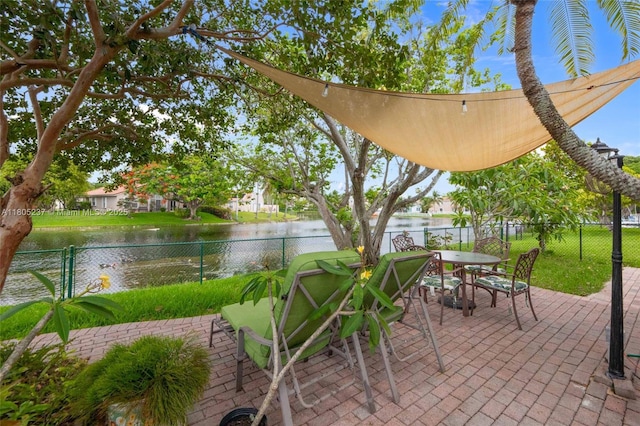 596 NW 164th Ave, Pembroke Pines, FL 33028 - fenced backyard with a patio area, a water view, and outdoor dining area