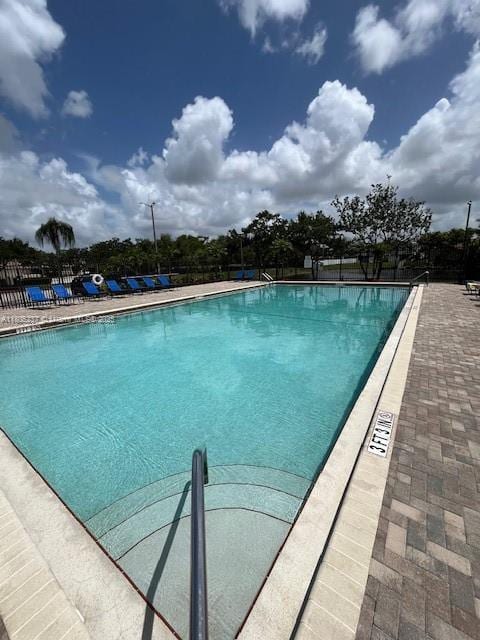 596 NW 164th Ave, Pembroke Pines, FL 33028 - community pool featuring a patio area