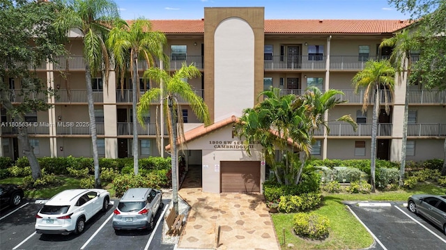 1300 SW 124th Ter Unit 107P, Pembroke Pines, FL 33027 - view of apartment building / complex featuring uncovered parking