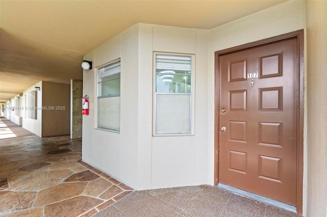 1300 SW 124th Ter Unit 107P, Pembroke Pines, FL 33027 - view of exterior entry featuring stucco siding