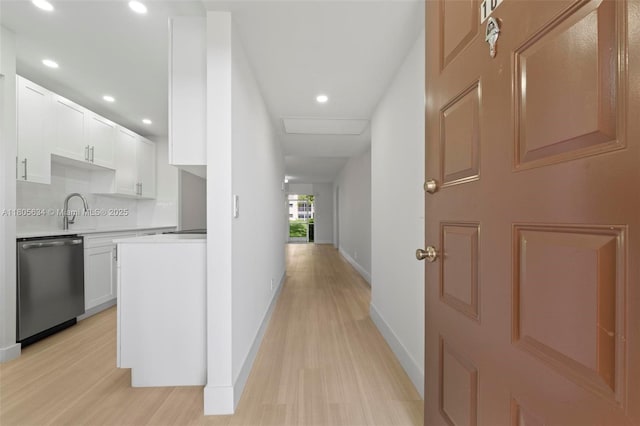1300 SW 124th Ter Unit 107P, Pembroke Pines, FL 33027 - hallway featuring light wood-style flooring, baseboards, recessed lighting, and a sink