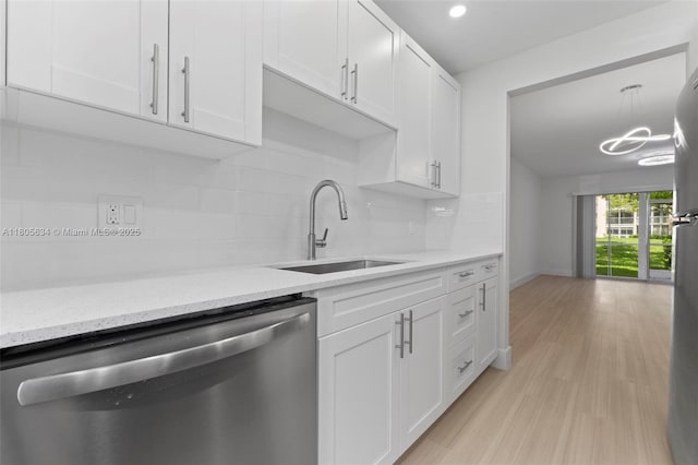 1300 SW 124th Ter Unit 107P, Pembroke Pines, FL 33027 - kitchen with stainless steel dishwasher, a sink, white cabinets, decorative backsplash, and recessed lighting