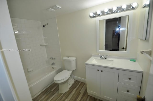 4441 W Mcnab Rd Unit 21, Pompano Beach, FL 33069 - bathroom featuring toilet, wood finished floors, vanity, shower / tub combination, and baseboards