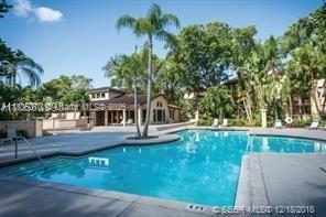 4441 W Mcnab Rd Unit 21, Pompano Beach, FL 33069 - community pool featuring a patio