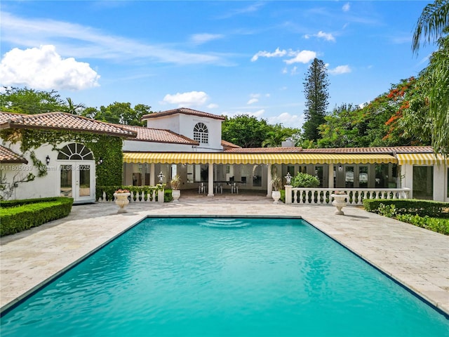 12300 Old Cutler Rd, Pinecrest, FL 33156 - outdoor pool with french doors and a patio area