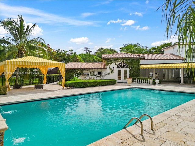 12300 Old Cutler Rd, Pinecrest, FL 33156 - swimming pool with french doors, a patio, and a gazebo