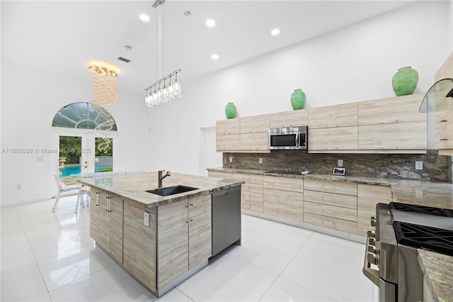 12300 Old Cutler Rd, Pinecrest, FL 33156 - kitchen featuring a sink, stainless steel appliances, light brown cabinets, french doors, and modern cabinets