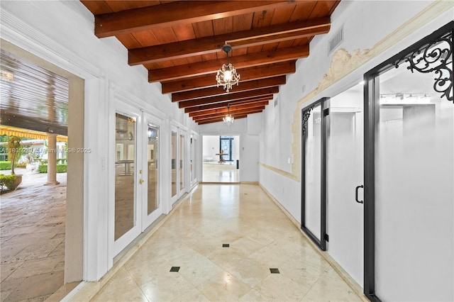 12300 Old Cutler Rd, Pinecrest, FL 33156 - corridor with wood ceiling with exposed beams, healthy amount of natural light, french doors, a chandelier, and baseboards