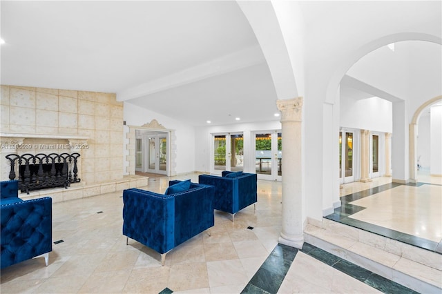 12300 Old Cutler Rd, Pinecrest, FL 33156 - living area featuring french doors, arched walkways, a tile fireplace, and recessed lighting