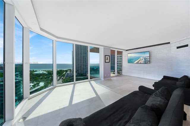 300 S Pointe Dr Unit 1505, Miami Beach, FL 33139 - living room with floor to ceiling windows and tile patterned flooring