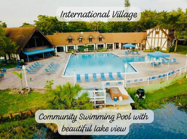 3660 Inverrary Dr Unit 2W, Lauderhill, FL 33319 - community pool featuring a patio area and fence
