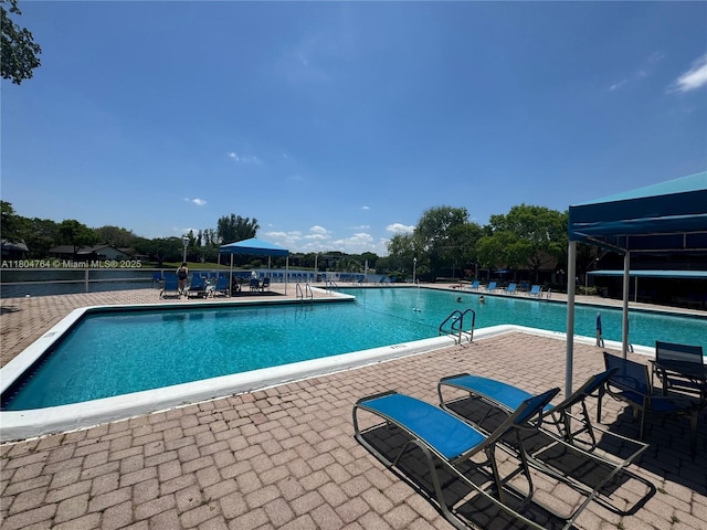 3660 Inverrary Dr Unit 2W, Lauderhill, FL 33319 - community pool with a patio area
